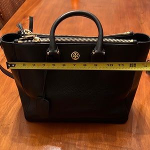Tory Burch bag used like once.  Comes without charm.